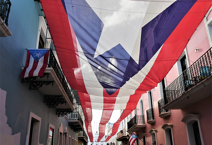 Puerto Rican flag hung between buildings